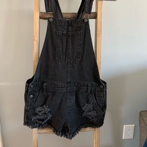 American Eagle women’s distressed black overalls/overall shorts size small